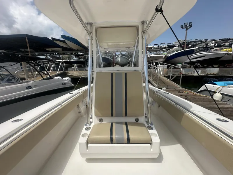 Slide: The Image of 2008 Contender 36 Open boat interior with seating, docked among other boats. - 43