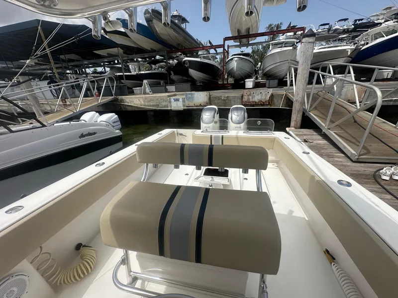 Slide: The Image of 2008 Contender 36 Open boat interior at marina with docked vessels. - 44
