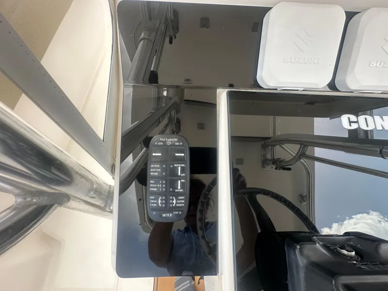 Slide: The Image of Control panel on a 2008 Contender 36 Open boat with Suzuki components. - 47