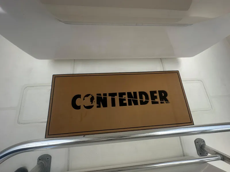Slide: The Image of Contender 36 Open 2008 boat deck with branded mat and railing. - 49