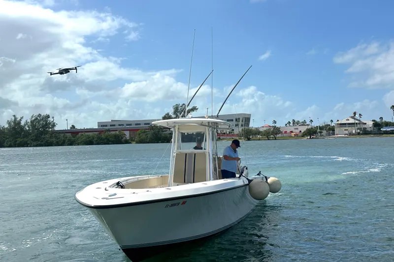 Slide: The Image of 2008 Contender 36 Open boat on water with drone flying nearby. - 65