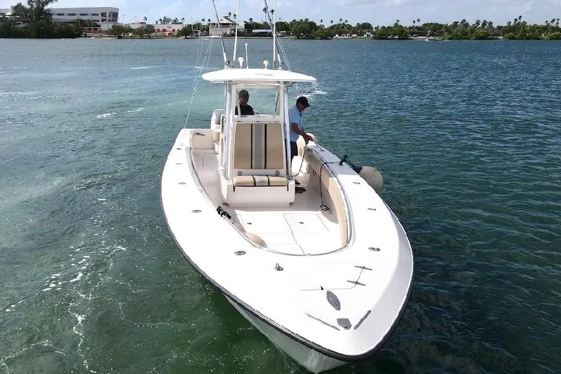 Slide: The Image of 2008 Contender 36 Open boat cruising on clear blue water. - 7