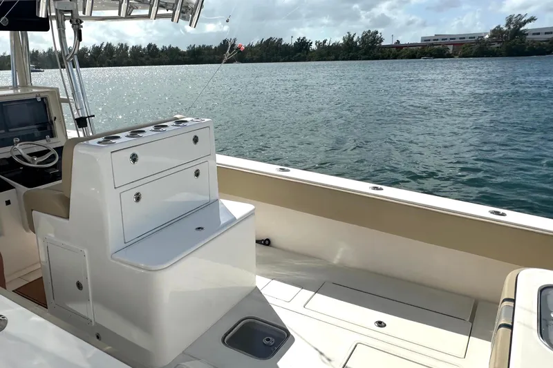Slide: The Image of 2008 Contender 36 Open boat interior with helm and storage, overlooking calm waters. - 71