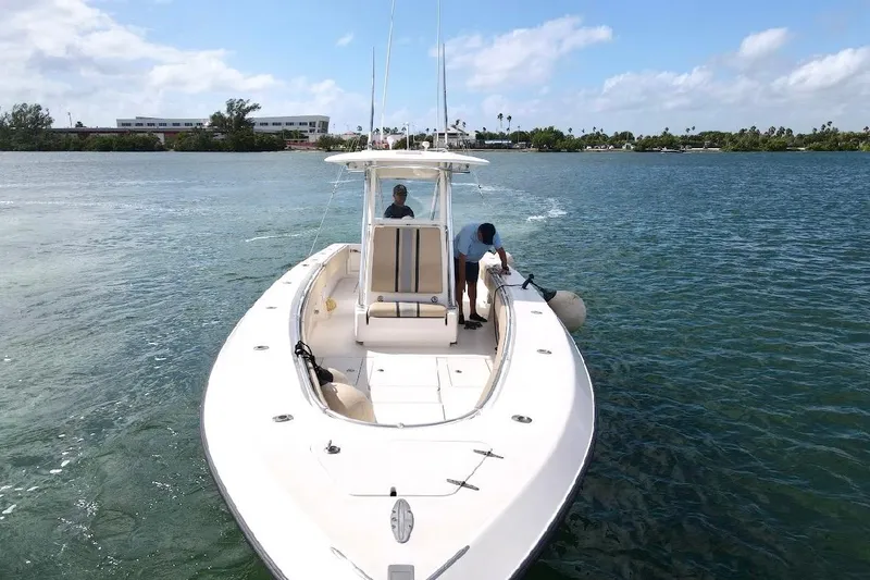 Slide: The Image of 2008 Contender 36 Open boat cruising on a sunny day with two people onboard. - 78