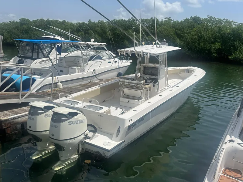 Slide: The Image of 2008 Contender 36 Open boat docked with dual Suzuki engines. - 8