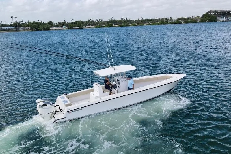 Slide: The Image of 2008 Contender 36 Open boat cruising on a calm blue sea. - 80