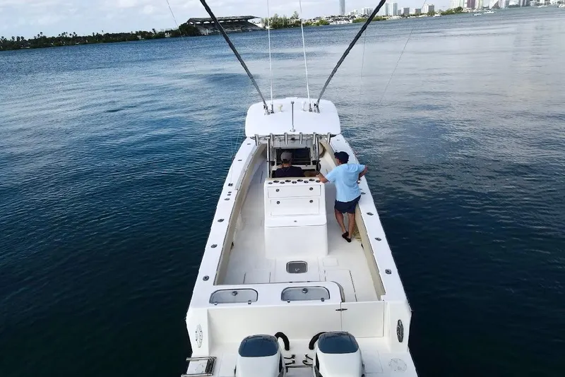 Slide: The Image of 2008 Contender 36 Open boat on calm water, viewed from above. - 82