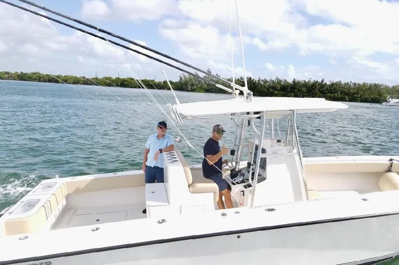 Slide: The Image of 2008 Contender 36 Open boat cruising on a sunny day with two people onboard. - 87