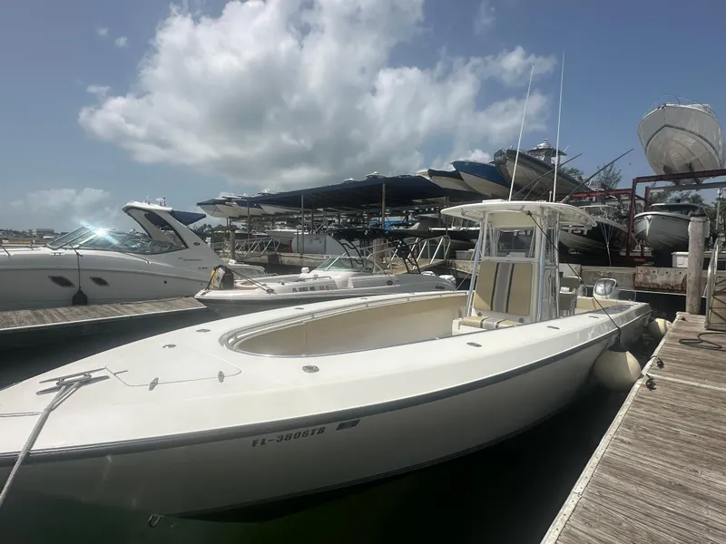 Slide: The Image of 2008 Contender 36 Open boat docked at marina under cloudy sky. - 9