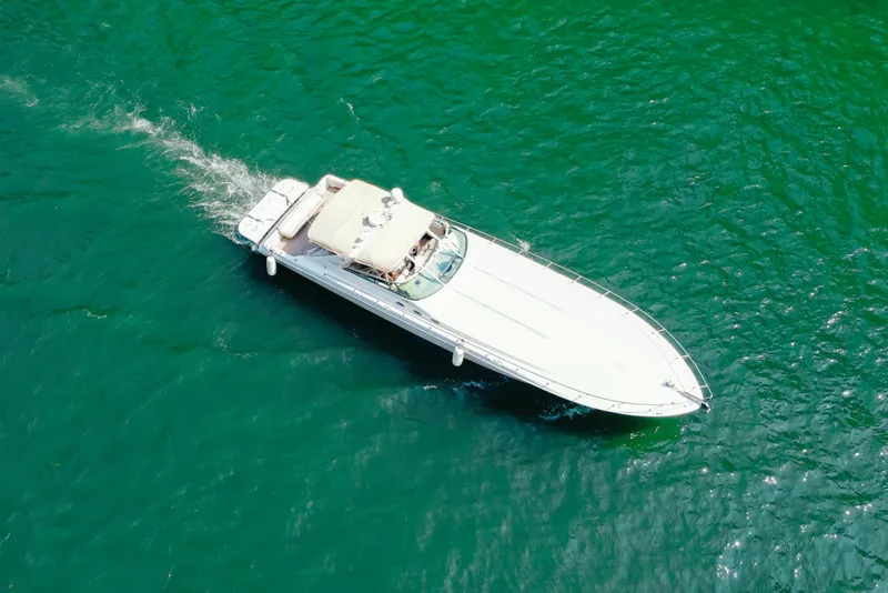 Slide: The Image of Aerial view of 1997 Sea Ray 630 Super Sun Sport yacht cruising on turquoise water. - 20