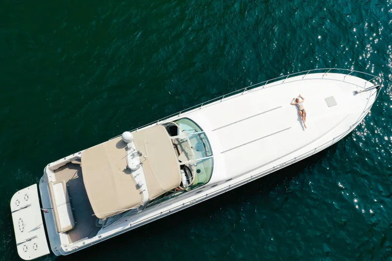 Slide: The Image of Aerial view of 1997 Sea Ray 630 Super Sun Sport yacht on blue water. - 25
