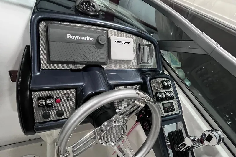 Slide: The Image of 2017 Formula 292 FASTech dashboard with Raymarine and Mercury controls. - 2