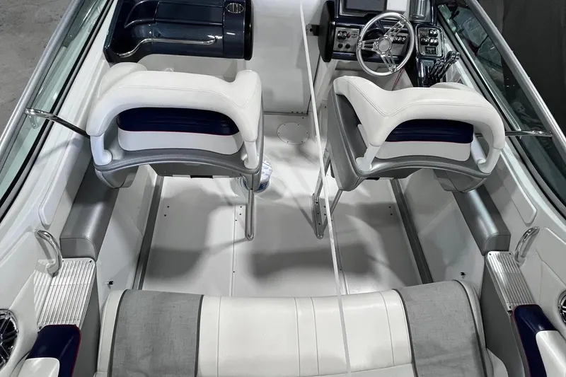 Slide: The Image of 2017 Formula 292 FASTech boat interior with white seating and modern dashboard. - 3