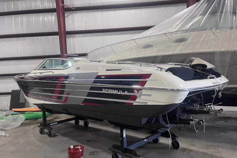 Slide: The Image of 2017 Formula 292 FASTech boat in storage, featuring sleek design and vibrant graphics. - 4