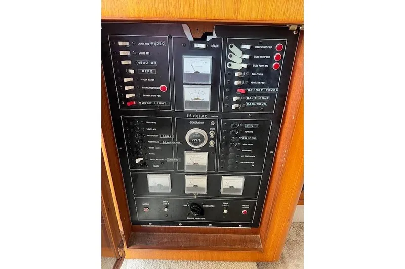 Slide: The Image of Electrical control panel of a 1981 Viking 35 Convertible boat, featuring various switches and gauges. - 17