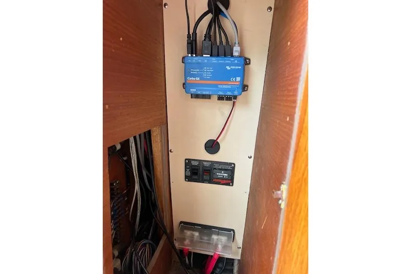 Slide: The Image of Electrical panel inside 1981 Viking 35 Convertible boat, featuring wiring and control systems. - 18