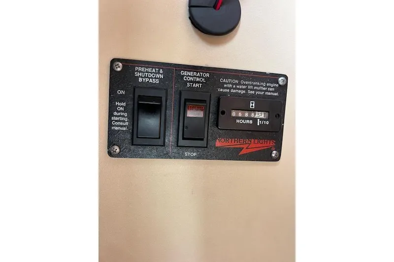 Slide: The Image of Control panel of a Northern Lights generator on a 1981 Viking 35 Convertible boat. - 19