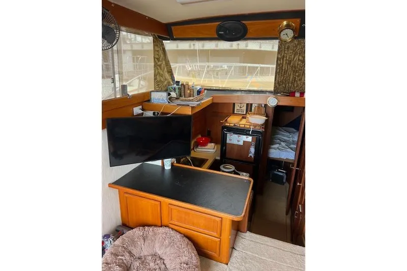 Slide: The Image of Interior of 1981 Viking 35 Convertible boat with kitchen and living area. - 22