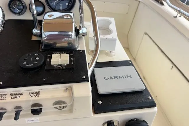 Slide: The Image of Control panel of 1981 Viking 35 Convertible boat with Garmin navigation system. - 35
