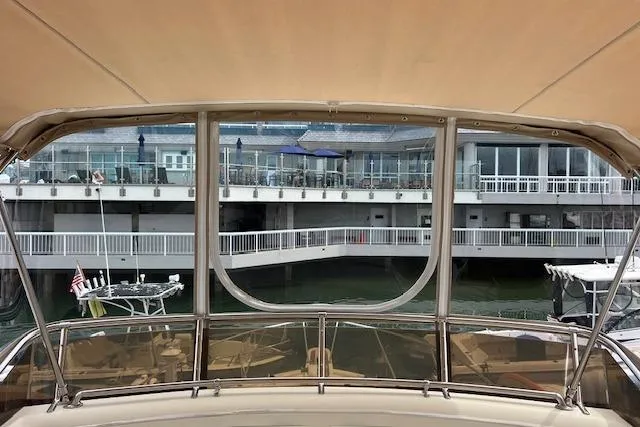 Slide: The Image of 1981 Viking 35 Convertible yacht docked at marina with waterfront view. - 36