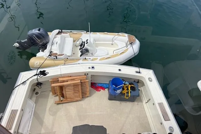 Slide: The Image of 1981 Viking 35 Convertible boat with dinghy and fishing gear on deck. - 40