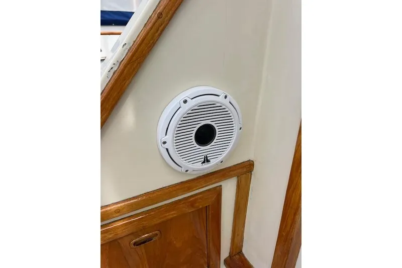 Slide: The Image of 1981 Viking 35 Convertible boat interior with a mounted white speaker. - 41