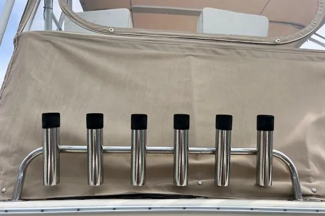 Slide: The Image of Rod holders on a 1981 Viking 35 Convertible boat, mounted on beige canvas. - 42