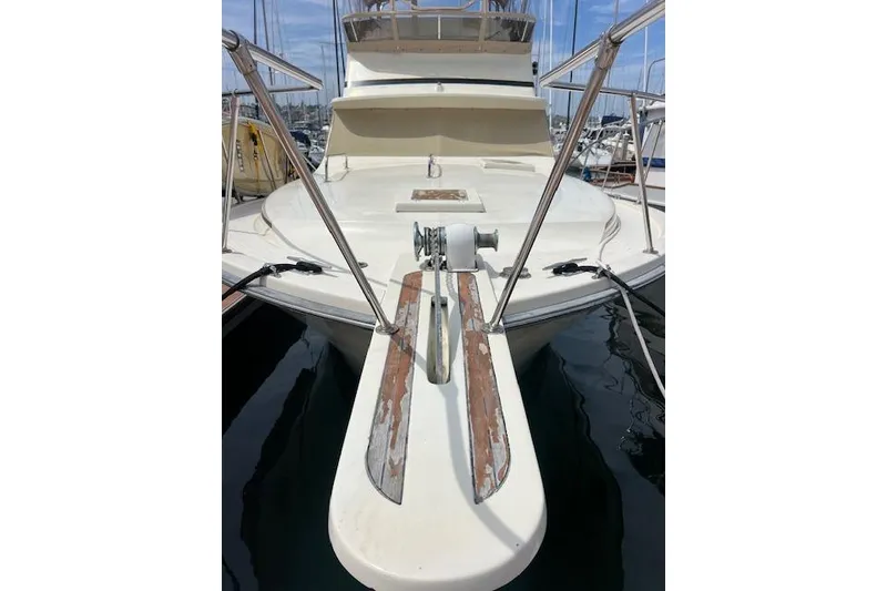 Slide: The Image of 1981 Viking 35 Convertible yacht bow view with railing and anchor system. - 5