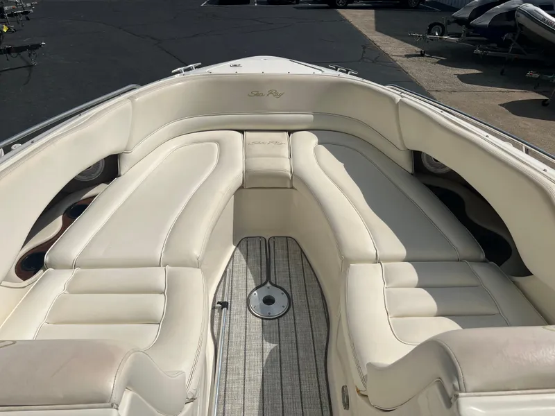 Slide: The Image of 2000 Sea Ray 280 Bowrider with white leather seating and spacious deck layout. - 14