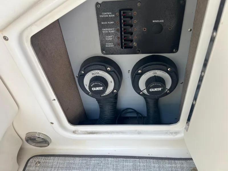 Slide: The Image of Control panel of a 2000 Sea Ray 280 Bowrider boat with switches and dials. - 18