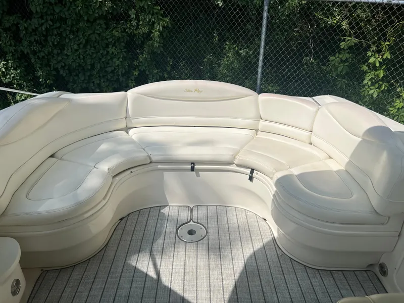 Slide: The Image of 2000 Sea Ray 280 Bowrider interior with white seating and striped flooring. - 6