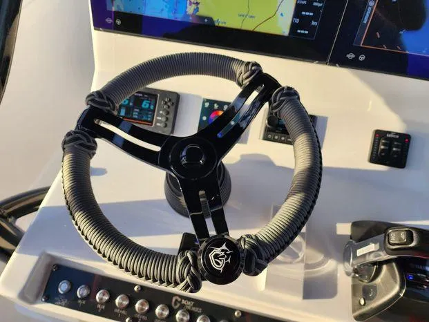 Slide: The Image of Steering wheel of 2022 CG Boat Works 35 M-Series with navigation controls. - 10