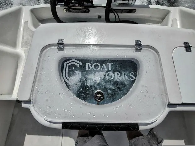 Slide: The Image of 2022 CG Boat Works 35 M-Series livewell with water splashes on the lid. - 6