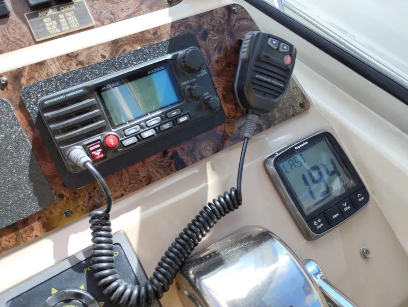 Slide: The Image of Control panel of a 1999 Sea Ray 400 Sundancer with radio and display. - 19