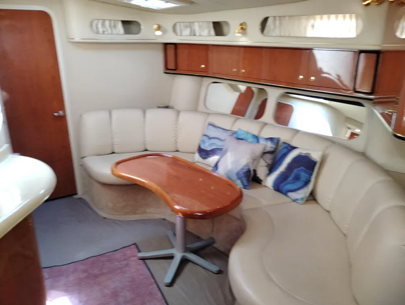Slide: The Image of Luxurious interior of 1999 Sea Ray 400 Sundancer yacht with plush seating and elegant decor. - 24