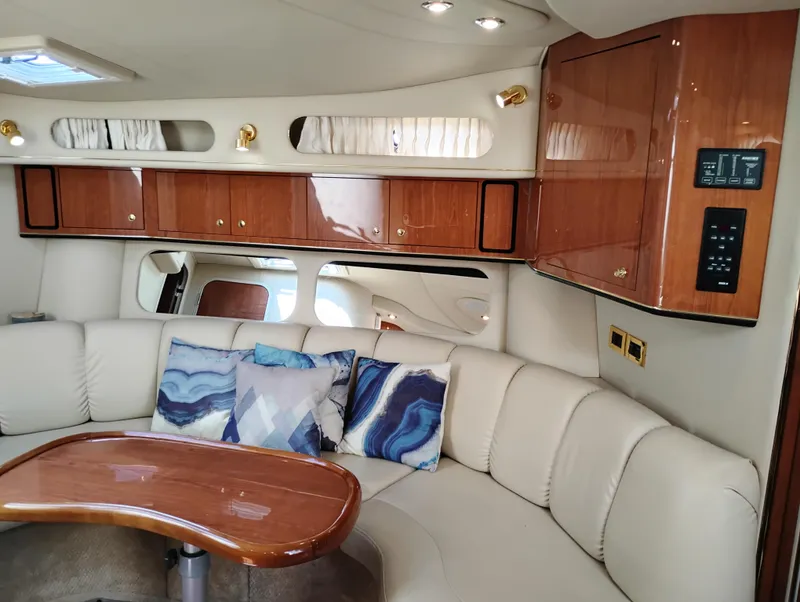Slide: The Image of Luxurious interior of 1999 Sea Ray 400 Sundancer yacht with plush seating and elegant wood finishes. - 25