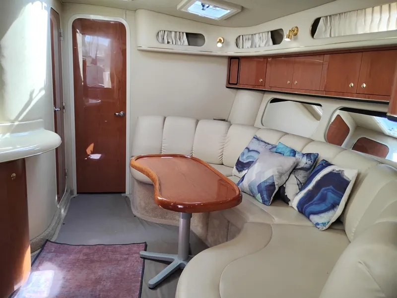 Slide: The Image of Luxurious interior of 1999 Sea Ray 400 Sundancer yacht with plush seating and elegant decor. - 35