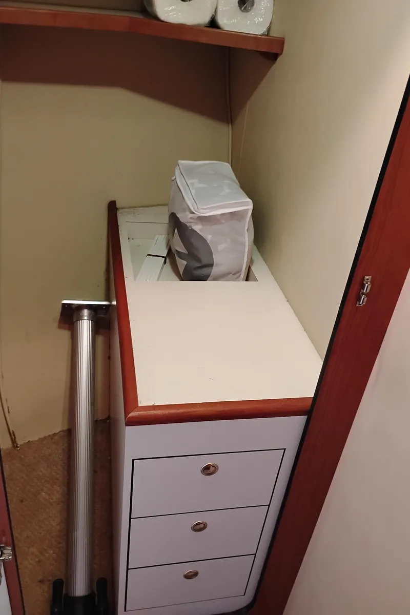 Slide: The Image of Interior storage area of a 1999 Sea Ray 400 Sundancer yacht with drawers and shelves. - 41