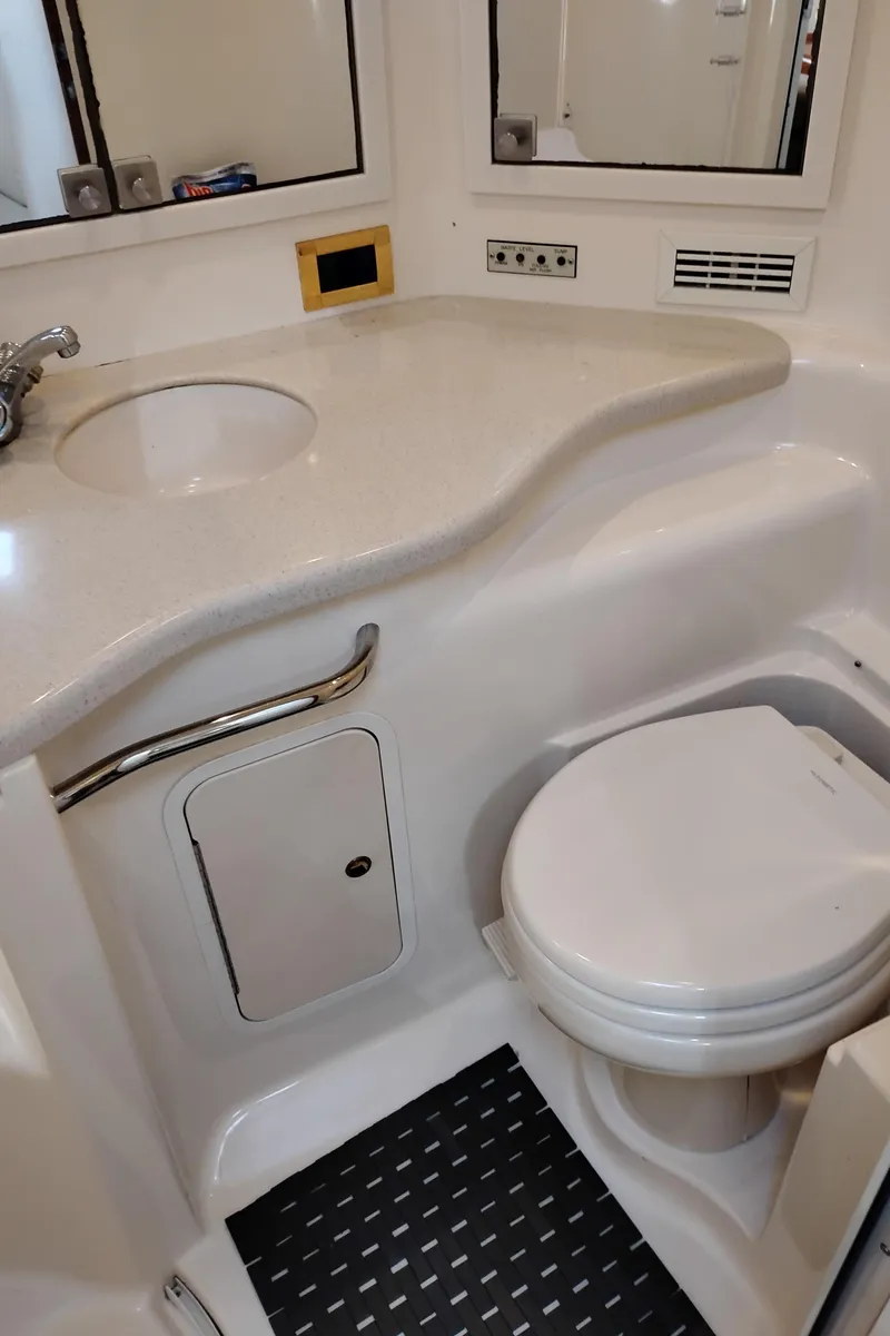 Slide: The Image of Bathroom interior of 1999 Sea Ray 400 Sundancer yacht, featuring sink and toilet. - 45