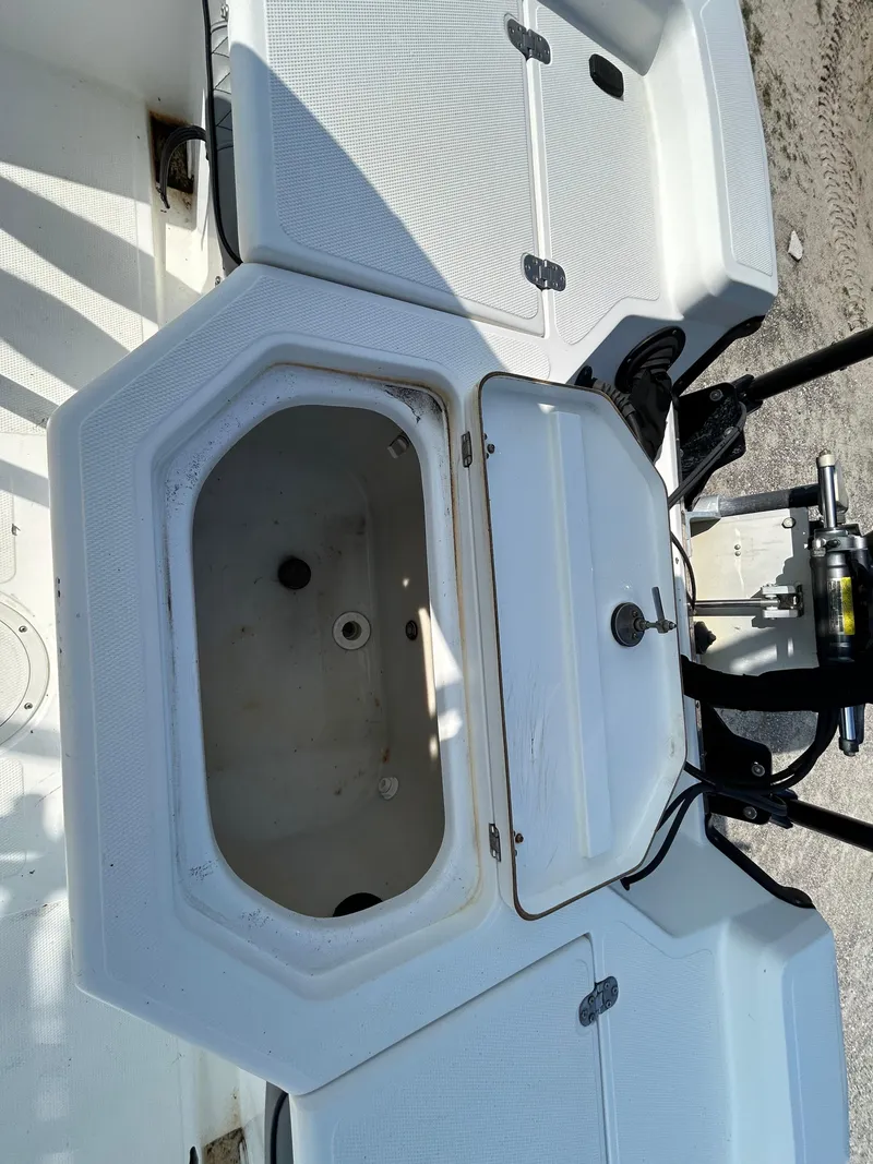 Slide: The Image of Open storage compartment on a 2008 Kenner Vision 2103 boat. - 13
