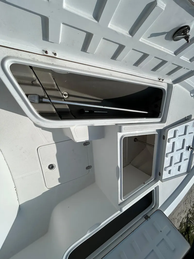 Slide: The Image of Open storage compartments on a 2008 Kenner Vision 2103 boat deck. - 15