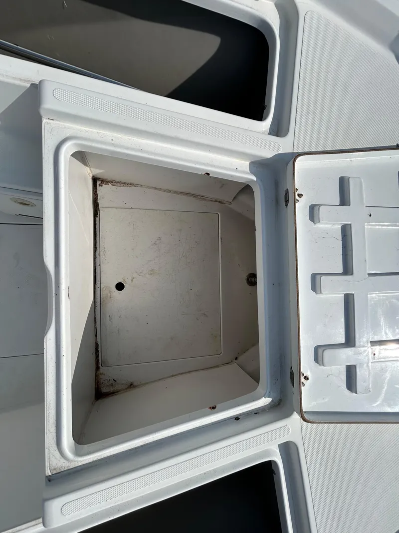 Slide: The Image of Open storage compartment on a 2008 Kenner Vision 2103 boat. - 17