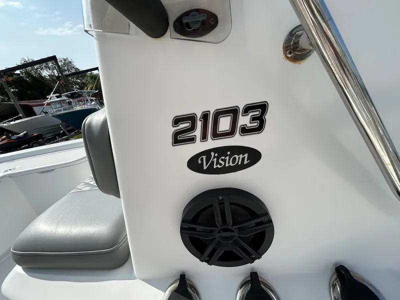 Slide: The Image of 2008 Kenner Vision 2103 boat interior with speaker and model branding. - 20