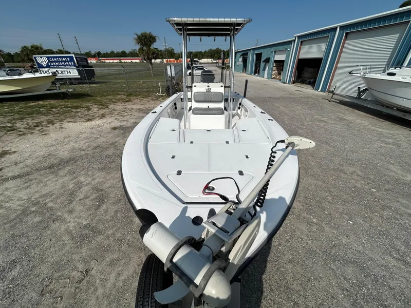 Slide: The Image of Kenner Vision 2103 boat, 2008 model, parked outdoors near storage units. - 6