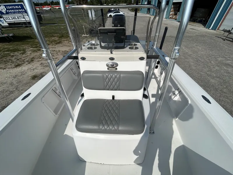 Slide: The Image of Kenner Vision 2103 boat interior, 2008 model, featuring gray cushioned seating and steering console. - 8