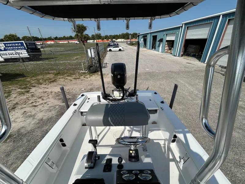 Slide: The Image of Kenner Vision 2103 boat, 2008 model, parked near industrial buildings. - 9