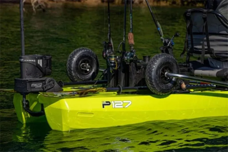 Slide: The Image of 2023 Bonafide P127 kayak with fishing gear and wheels on a calm lake. - 5