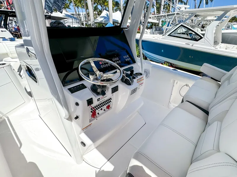 Slide: The Image of 2025 Edgewater 262CC boat interior with modern helm and seating. - 4