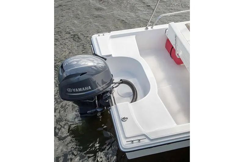 Slide: The Image of 2024 Edgewater 158CS boat with Yamaha outboard motor on water. - 4