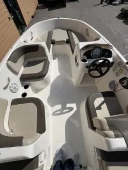 Slide: The Image of 2017 Bayliner Element E16 boat interior with seating and steering console. - 5